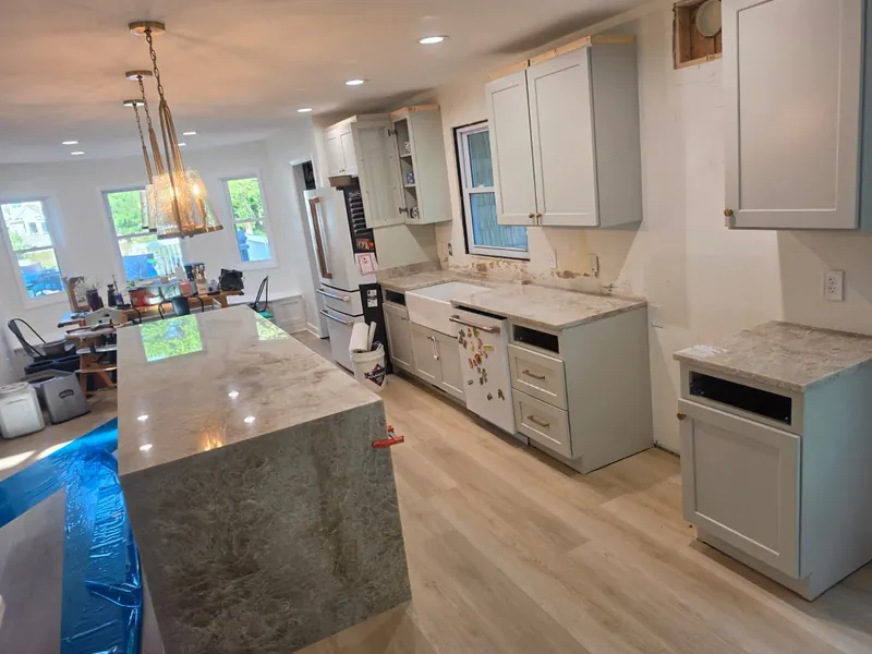 Taj Mahal-look waterfall island with a farmhouse sink – Beltway Countertops, Northern Virginia