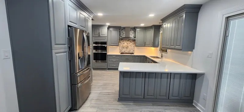 White countertop in a U-shaped kitchen with gray cabinets – Beltway Countertops, Northern Virginia