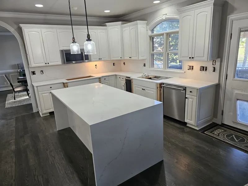 White quartz waterfall island with a full-height backsplash – Beltway Countertops, Northern Virginia